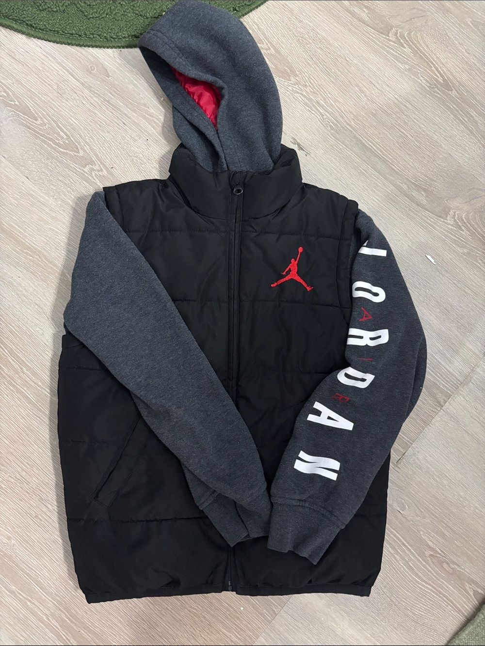 Jordan Black Puffer Jacket with Gray Sleeves and Red Logo